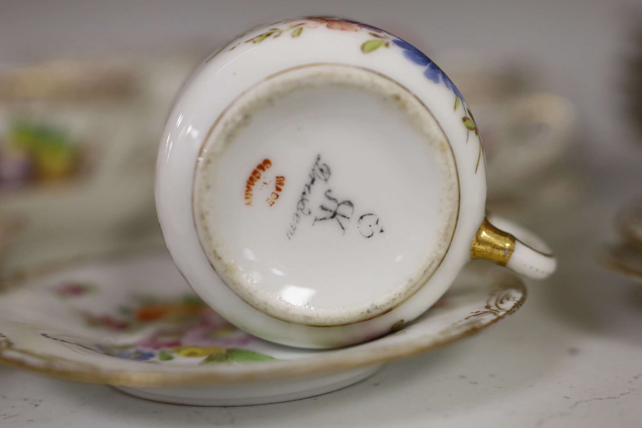 A group of Dresden floral cups and saucers, and five jewelled cabinet plates, etc.